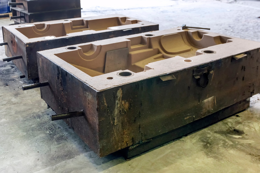View of the sand mold for steel casting. Sand casting, also known as sand molded casting, is a metal casting process characterized by using sand as the mold material.